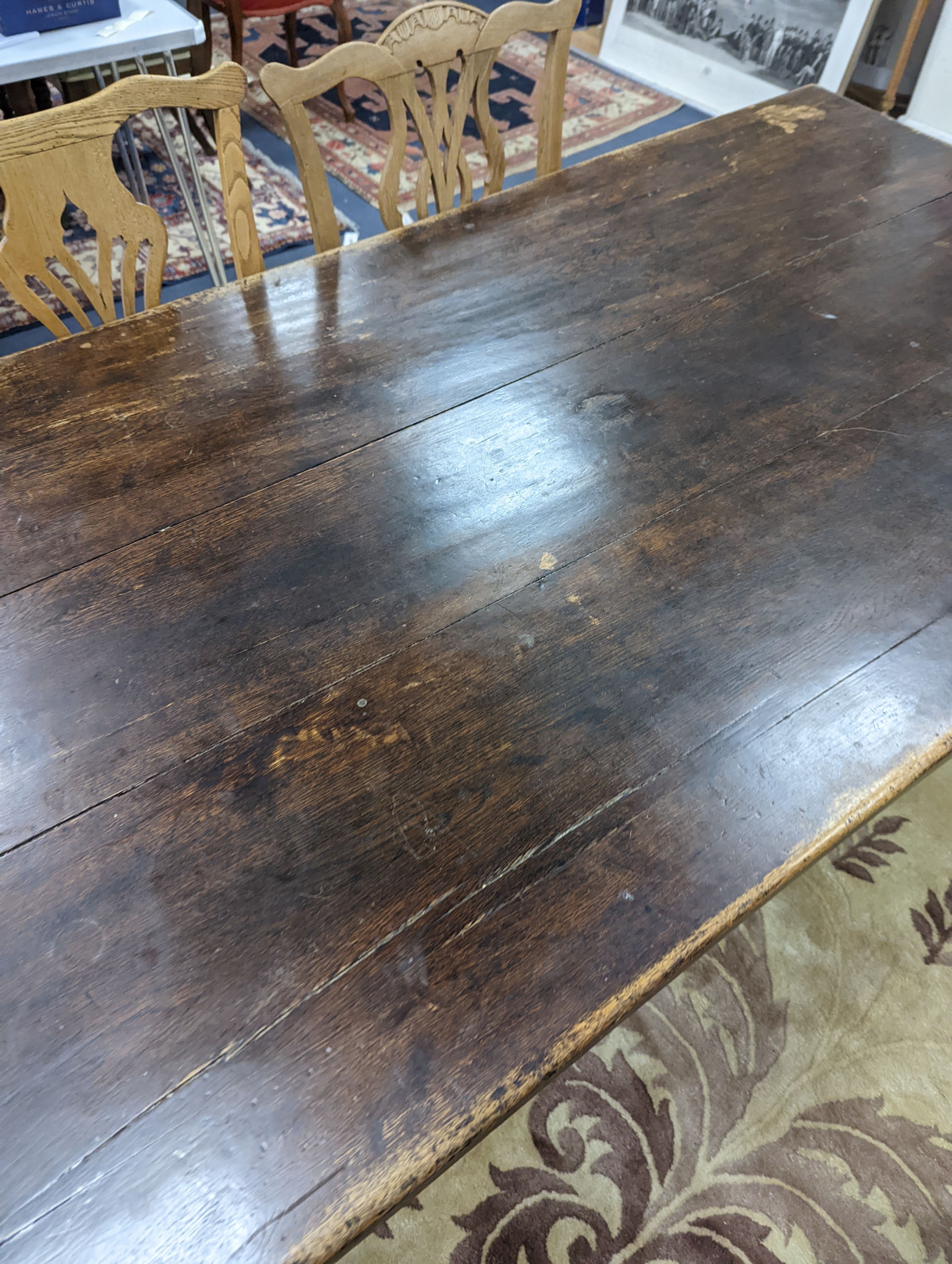 A 17th century style rectangular oak refectory dining table. Length -183cm, Width-91cm, Height-74cm.